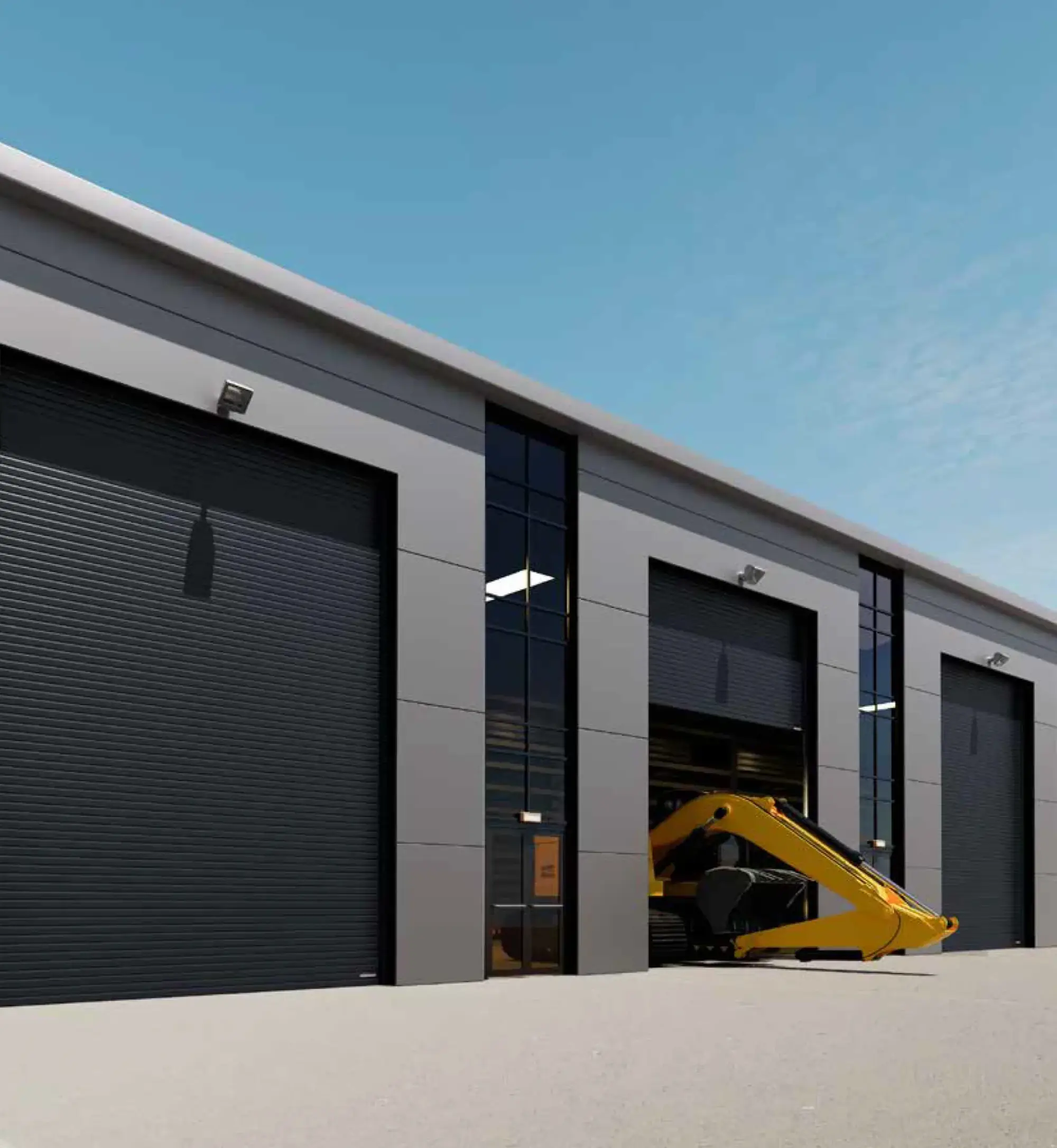 Gewerbehalle mit dunkler Fassade und mehreren großformatigen Industrietoren